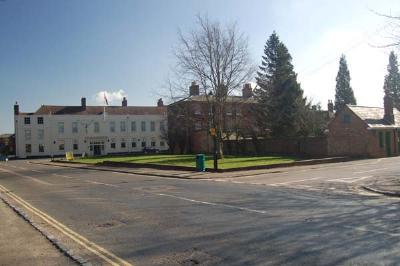 On the green space were, receding from the camera, Swan, White Horse Windmill and Coach and Horses